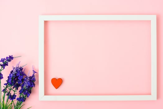 Valentine's Day Concept, Top view Flat lay, photo frame on Pink background with copy space for your text