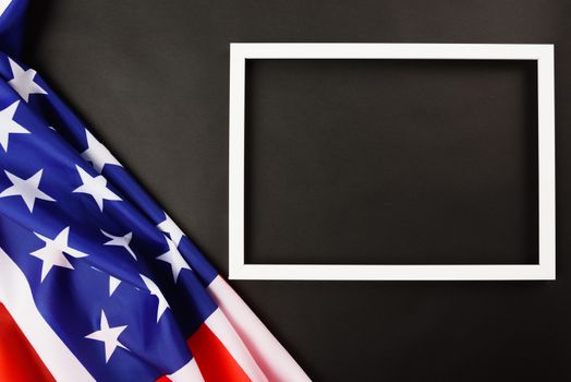 Martin luther king day, flat lay top view, American flag and photo frame on black background with copy space for your text