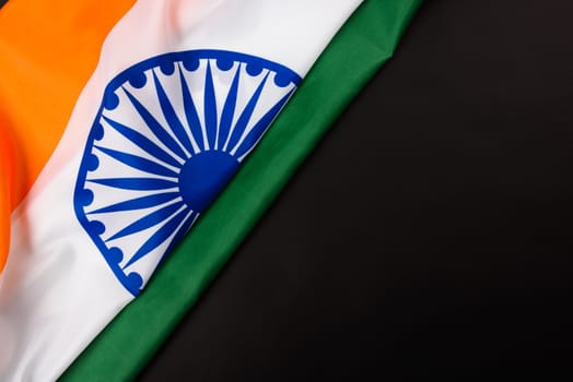 Indian republic day, flat lay top view, Indian flag on black background with copy space for your text