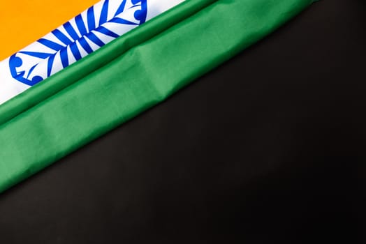 Indian republic day, flat lay top view, Indian flag on black background with copy space for your text