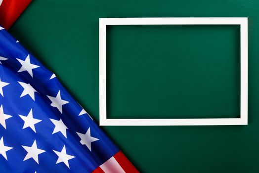 President's Day Concept, flat lay top view, America Flag and photo frame on Olive green background with copy space for your text
