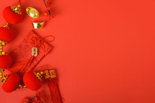 Chinese new year festival concept, flat lay top view, Happy Chinese new year with Red envelope and gold ingot on red background with copy space for your text