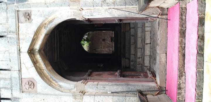the entrance of an old fort in Maharashtra India