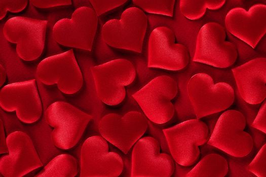 Valentine's day many red silk hearts background, love concept