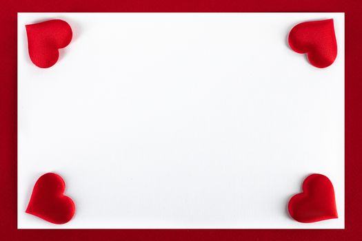 Valentine's day red silk hearts, background border frame with white card with copy space, love concept