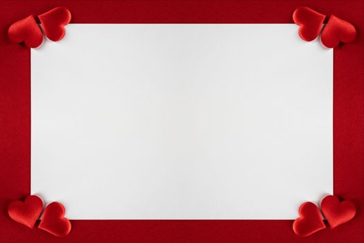 Valentine's day red silk hearts, background border frame with white card with copy space, love concept