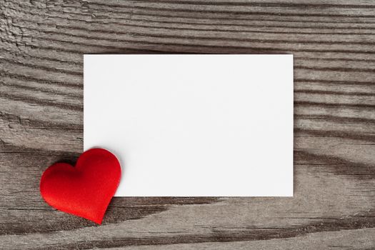 Valentine's day white blank paper greeting card and red silk hearts, background border frame with copy space, love concept