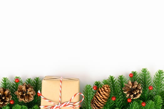 Happy new year or christmas day top view decorative fir tree and gift box on white background with copy space for your text