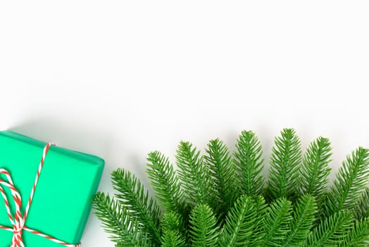 Happy new year or christmas day top view decorative fir tree and gift box on white background with copy space for your text