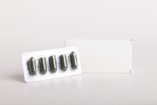 White pills box. Plastic bottles. Drugs box mock-up. Medical blank cardboard. Pills bottle. Mockup.