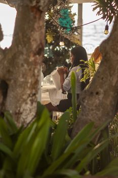BAYAHIBE, DOMINICAN REPUBLIC 13 DECEMBER 2019: Dominican girl at work