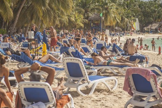 BAYAHIBE, DOMINICAN REPUBLIC 13 DECEMBER 2019: Resort loungers full of tourists