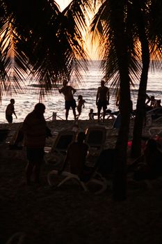 BAYAHIBE, DOMINICAN REPUBLIC 13 DECEMBER 2019: Silhouette of people on the beach at sunset