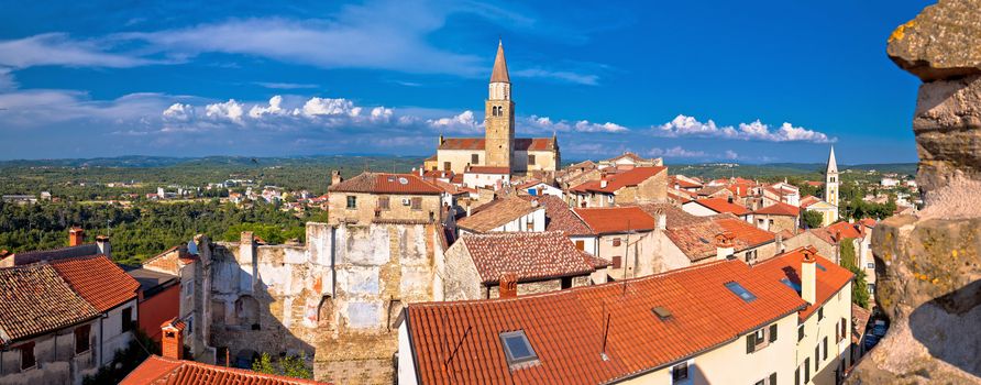 Old stone town of Buje towers and skyline panoramic view, town in green landscape of Istria, Croatia