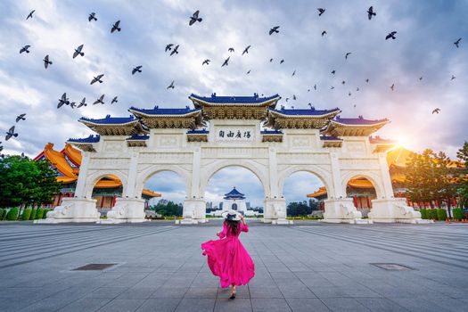 Woman walking at Archway of Chiang Kai Shek Memorial Hall in Taipei, Taiwan.