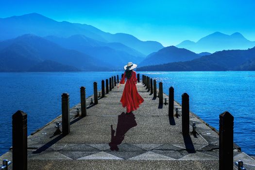 Beautiful girl walking at Sun Moon Lake in Taiwan.