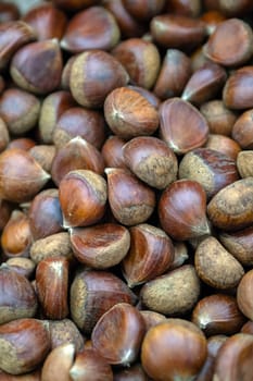 Chestnuts in basket in supermarket, first-person view, closeup