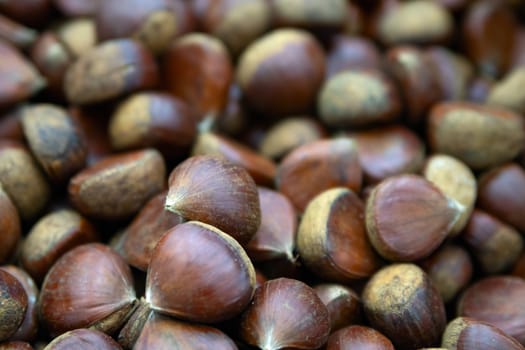 Chestnuts in basket in supermarket, first-person view, closeup