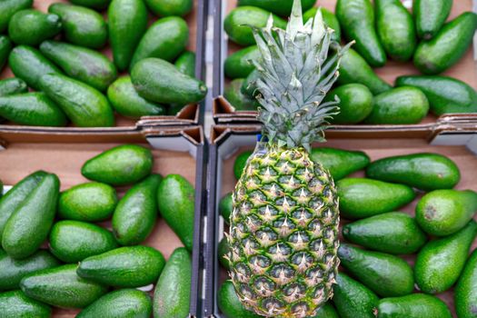 Pineapple, fruit in trays that are being sold in shops and supermarkets in the city