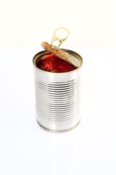 a jar of tomato sauce on a white surface