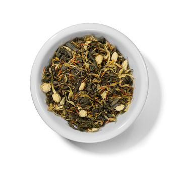 Green tea with aromatic additives. Top view on white background.
