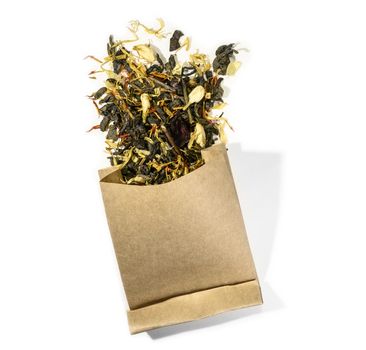 Green tea with aromatic additives. Top view on white background.