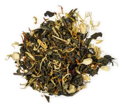 Green tea with aromatic additives. Top view on white background.