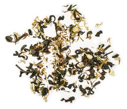 Green tea with aromatic additives. Top view on white background.