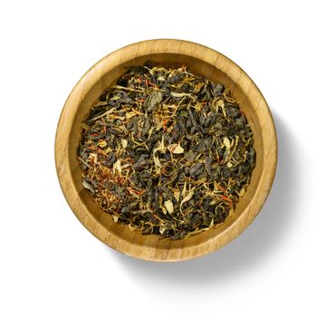 Green tea with aromatic additives. Top view on white background.