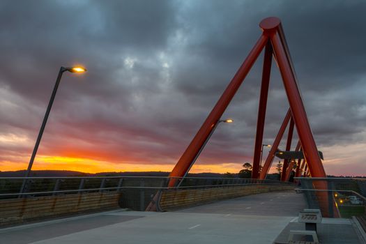 Sunset skies and the Yandhai Nepean Crossing, a bridge crossing the Nepean River.  Location:  Penrith, Australia