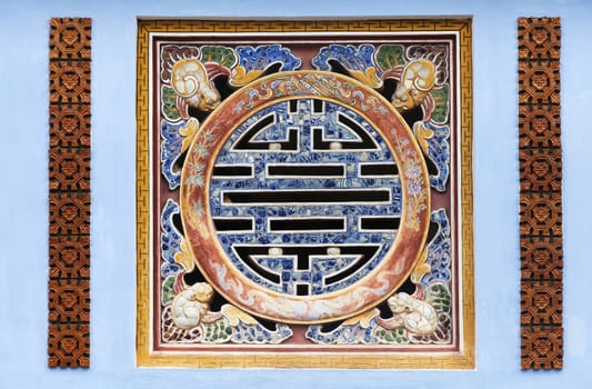 Chinese longevity symbol made of ceramic in Imperial City of Hue, Vietnam