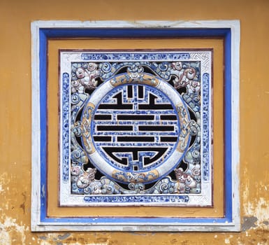 Chinese symbol of wealth made of ceramic in Imperial City of Hue, Vietnam
