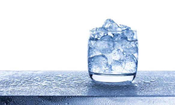 Water with crushed ice cubes in glass isolated on white background with copy space