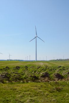 Bright blue sky moving and wind turbine.