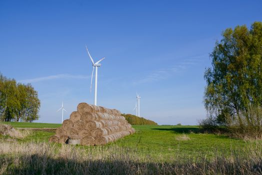 Bright blue sky moving and wind turbine.