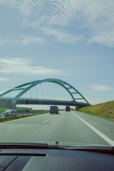 Car view over the steel bridge in summer day