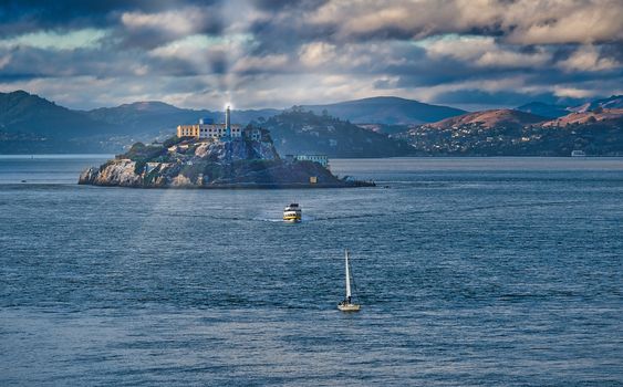 Two boats leaving Alcatraz with Spotlight Shining