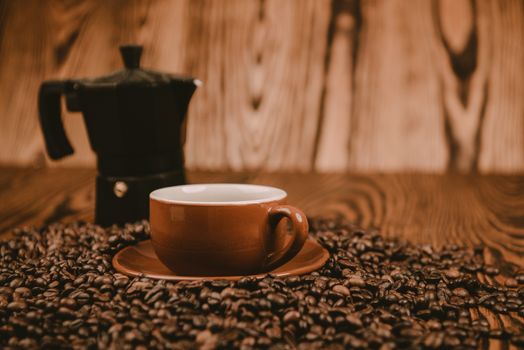 Coffee cup and beans on a background