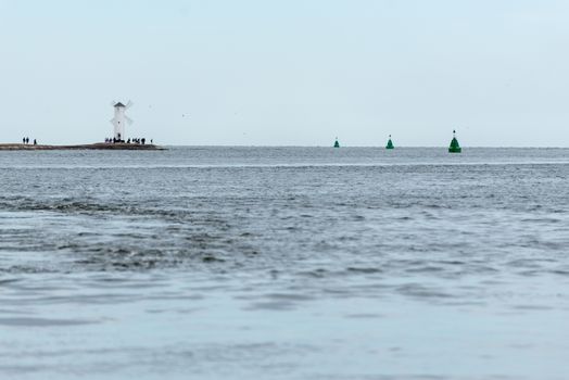 Old lighthouse in Swinoujscie, a port in Poland on the Baltic Sea. The lighthouse was designed as a traditional windmill. Panoramic image