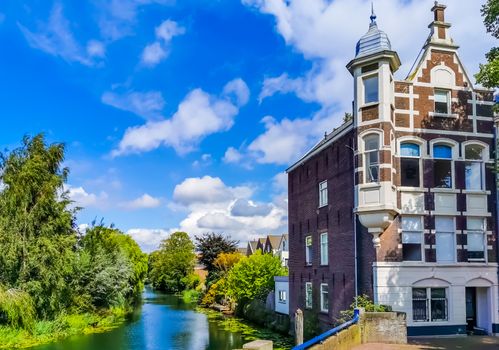 classical residential building at the canal in dordrecht, The netherlands, vintage city architecture