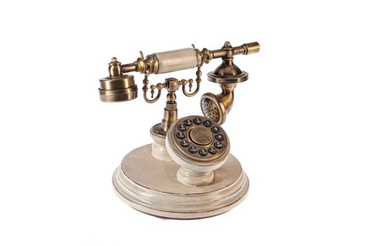 Old telephone on an isolated studio background