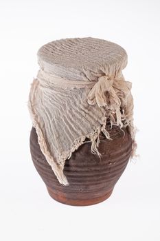 Old ceramic pot on an isolated studio background