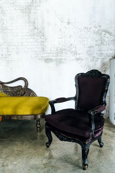 antique sofa on brick wall background