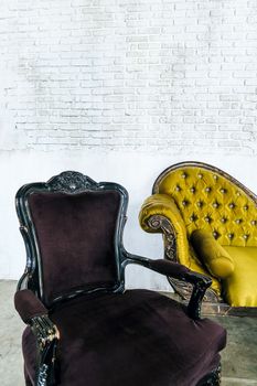 antique sofa on brick wall background