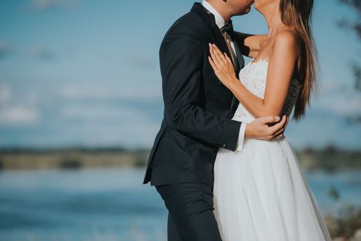 Bride and groom at a photo session in the nature.