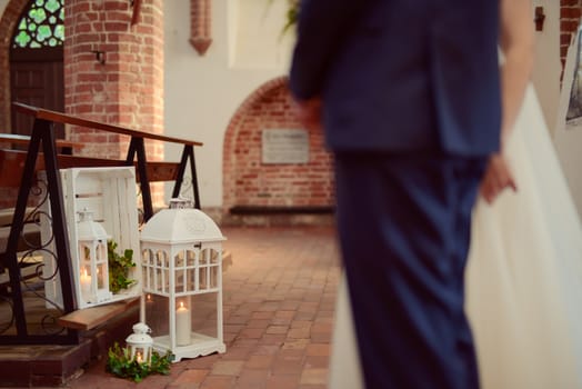 Church sanctuary before a wedding ceremony. Empty chairs for bride and groom