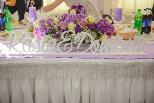 Beautifully decorated wedding table and other details at wedding hall. Wedding day