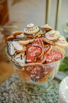 Delicious sweets on candy buffet. Wedding bakes on trays.