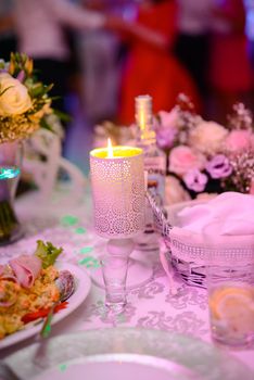 Beautifully decorated wedding table and other details at wedding hall. Wedding day