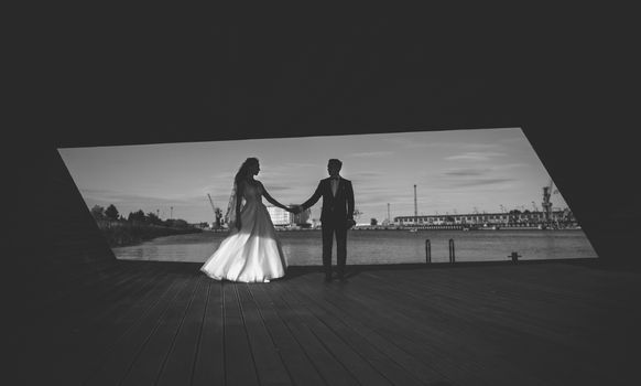 Bride and groom at a photo session in the marina area